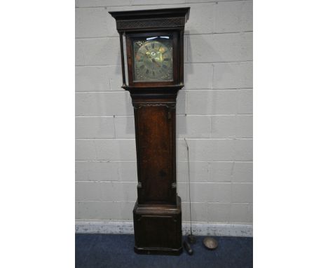 A GEORGIAN OAK 30 HOUR LONGCASE CLOCK, the box hood with blind fretwork, reeded pillars flanking a glass door that's enclosin