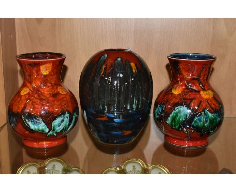 THREE ANITA HARRIS ART POTTERY VASES, two florally decorated baluster vases, with printed backstamps, one with Anita Harris s