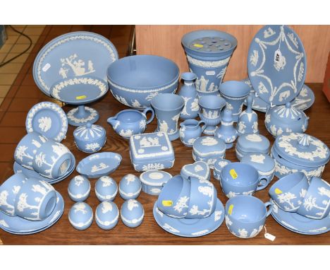 A LARGE QUANTITY OF BLUE WEDGWOOD JASPERWARE, comprising two cabinet plates, one oval plaque, large fruit bowl, a small pedes