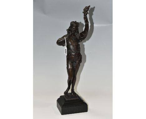 A HOLLOWCAST BRONZE SCULPTURE OF A MALE FIGURE, he is holding a horn in his right hand and a flaming torch in his left, no ma