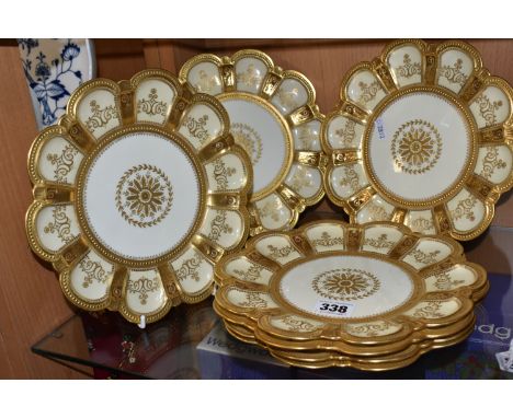 SEVEN ROYAL CROWN DERBY DESSERT PLATES, in the Lichfield shape, pattern no 3179, with heavily gilt scalloped rims and gilt fo