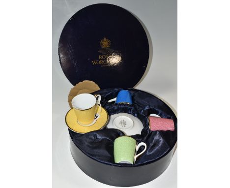 A BOXED ROYAL WORCESTER HARLEQUIN SET OF FOUR COFFEE CUPS AND SAUCERS, bears backstamp 'In Celebration of HRH 80th Birthday',