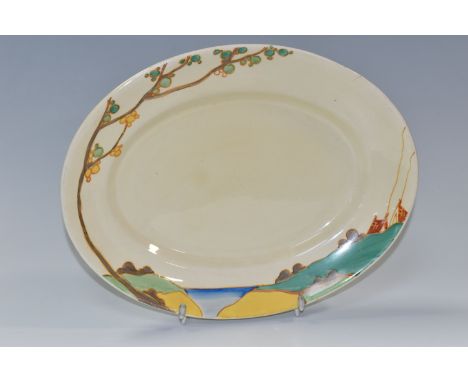 A CLARICE CLIFF OVAL 'SECRETS' PATTERN MEAT PLATE, painted with a stylised tree and cottages in a landscape, printed backstam