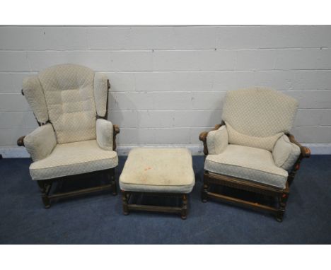 AN ERCOL 'CLOISTER' ELM AND BEECH THREE PIECE SUITE, comprising a ladies and gents armchair, along with a footstool (conditio