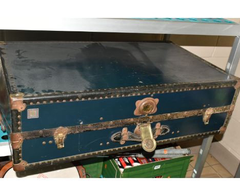 A VINTAGE 'WATAJOY' DARK BLUE LEATHER MOUNTED CABIN TRUNK WITH CUNARD WHITE STAR TO EUROPE LABEL TO THE LID, partially over s