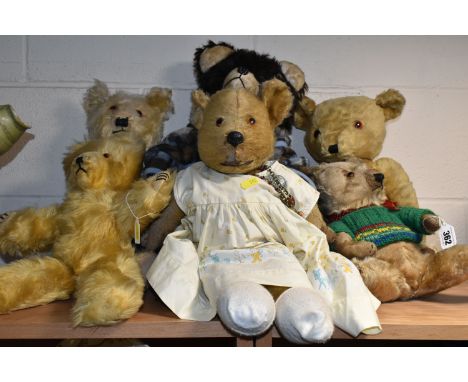 SIX VINTAGE TEDDY BEARS, comprising a much loved straw filled jointed bear, glass eyes. stitched nose and mouth, much loved c