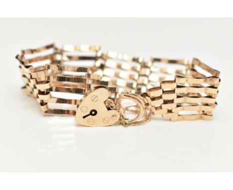 A 9CT GOLD GATE BRACELET, five bar bracelet, approximate width 15.8mm, fitted with a heart padlock clasp, hallmarked 9ct Lond