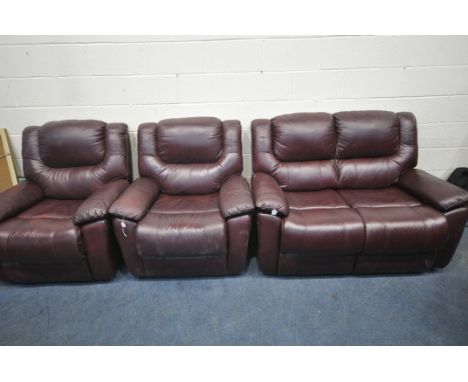 A SOFA HOUSE PLUM UPHOLSTERED THREE PIECE LOUNGE SUITE, comprising a two seater sofa, along with two manual reclining armchai