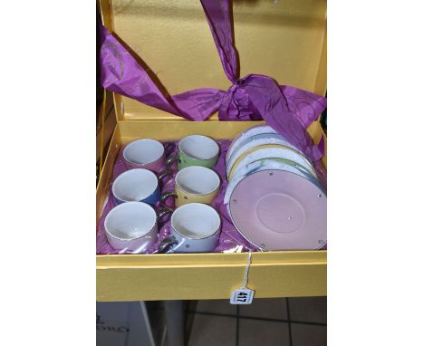 A SEALED BOXED CAROLYN QUARTERMAINE COFFEE SET, comprising six coffee cans and six saucers in assorted colours with diamanté 