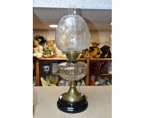 AN ART NOUVEAU OIL LAMP AND SHADE, complete with chimney, approximate height excluding shade 35cm, approximately 52cm with th