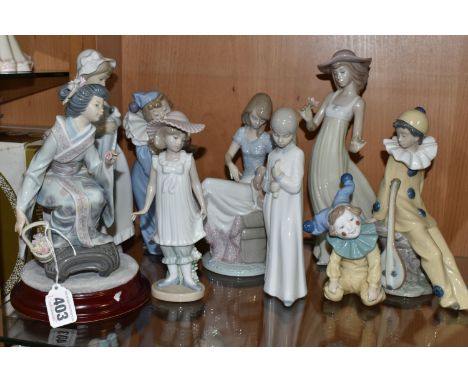 A GROUP OF LLADRO AND NAO FIGURINES, comprising Lladro figures 'Picture Perfect' model  no 7612, sculptor Juan Huerta, issued