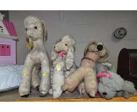 A DEANS RAG BOOK MUSICAL SOFT TOY LAMB, in well love play worn condition with fur loss, fading, marking and wear, missing one
