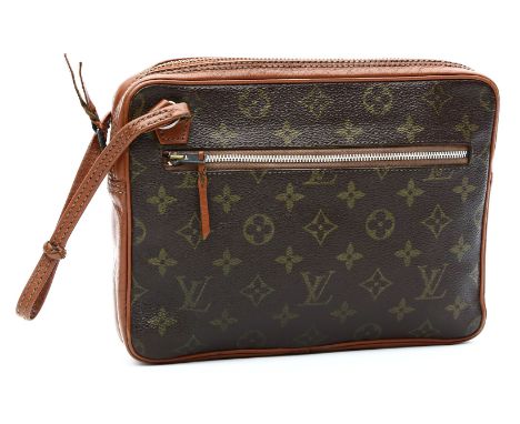 Vintage-Handgelenktasche, "Louis Vuitton". Braunes Monogram Canvas mit brauner Ledereinfassung und -innenauskleidung mit seit