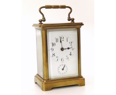 A French brass framed carriage clock, with white enamel face and Arabic numerals. Subsidiary alarm dial. Eight-day, two-train