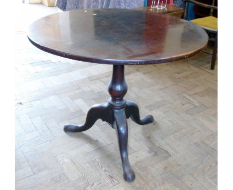 A George III mahogany tripod table, 85cm diameter Unfortunately we are not doing condition reports for this sale.