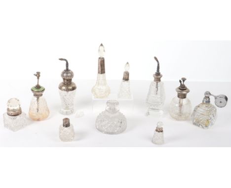 Eleven scent bottles, some with applied silver mounts, one Art Deco example with cloisonné enamel lid, 19th – 20th century, t