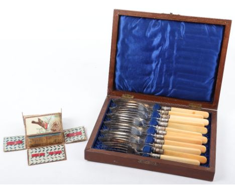 A Victorian ‘The Royal Needle Case’ , casket form, lid and sides dropping to reveal painted interior, 8cmW, with a silver pla