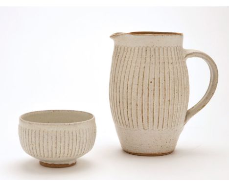 David Andrew Leach: a stoneware jug and sugar bowl, cream glaze with fluted decoration, both stamped with different marks, ju