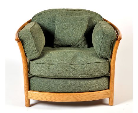 Four modern light elm Ercol Renaissance low back armchairs, the backs and arms of curved design, with straight splat backs, p