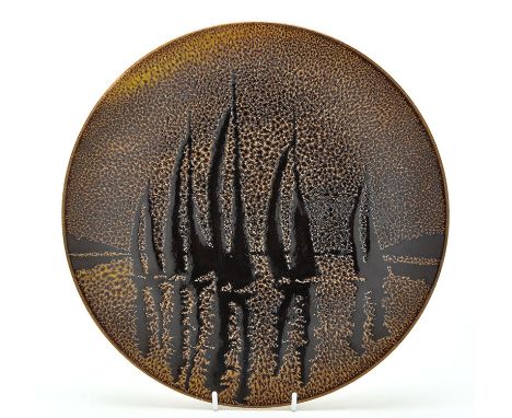 A Poole Pottery 'Aegean' charger, decorated with a yachting scene, 35cms (13 3/4in) diameter.