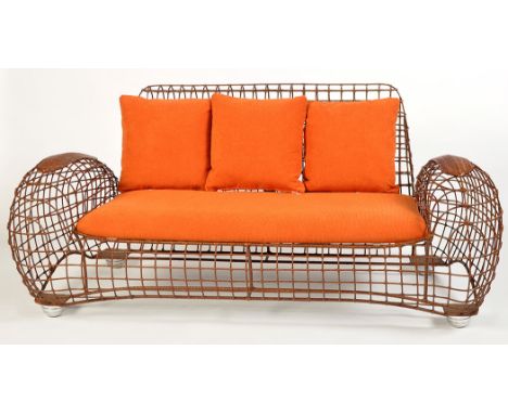 A 'Costabella' chair sofa and chair, powder coated steel frame with rattan weave, aluminum legs.