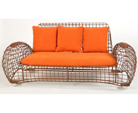 A 'Costabella' chair sofa and chair, powder coated steel frame with rattan weave, aluminum legs.