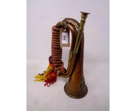 An early 20th century copper and brass bugle  