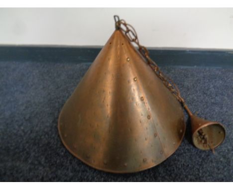 A copper conical pendant light fitting 