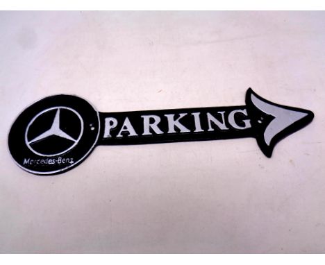 A cast iron plaque, Mercedes parking arrow 