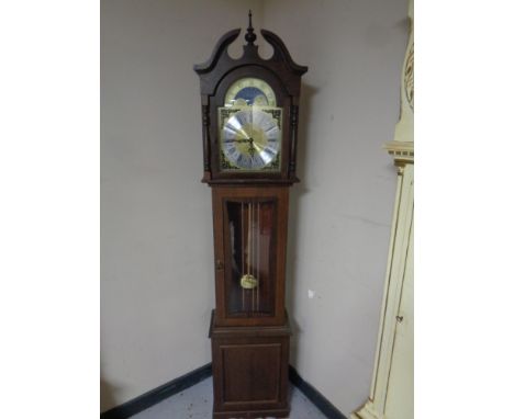 A contemporary longcase clock with moon phase dial  