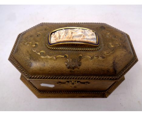 A 19th century gilt metal octagonal jewellery casket with relief panel inset 