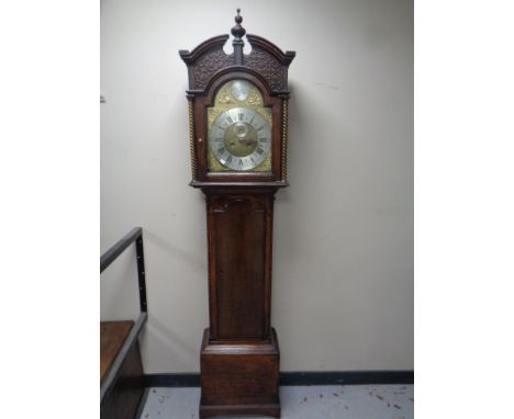 A 19th century carved oak cased longcase clock with brass and enamel dial signed William Reader of Hull , pendulum and two we