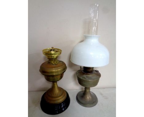 A brass Duplex oil lamp on ceramic base together with a further chrome oil lamp with glass chimney and shade  