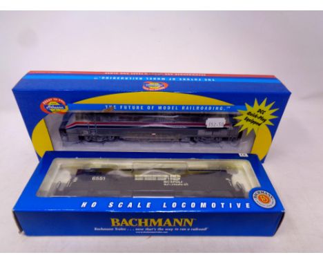 A Bachmann HO Scale NS Norfolk Southern locomotive, together with a further Athearn Amtrak locomotive, boxed 