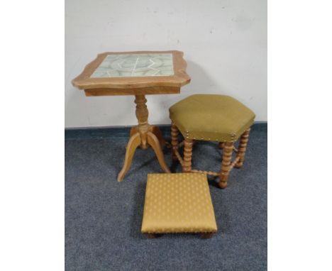 A blonde oak tile topped wine table together with a further blonde oak hexagonal footstool on bobbin legs and a further foots