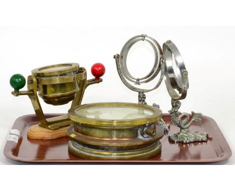 A brass nautical compass; another nautical compass on gimbal and a pair of wall lights modelled as fish with gimbal holders