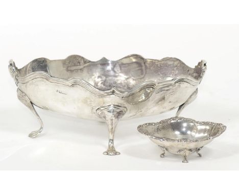 An Edwardian shaped oval silver bowl, Hawksworth, Eyre & Co, Sheffield 1906, on four stylised supports; and an American shape