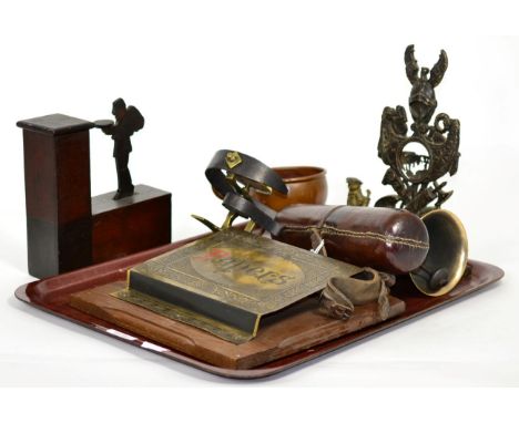 Assorted collectables comprising: a cast pocket watch stand; a shop bell; a brass 'Papers' rack; a novelty money box; table b