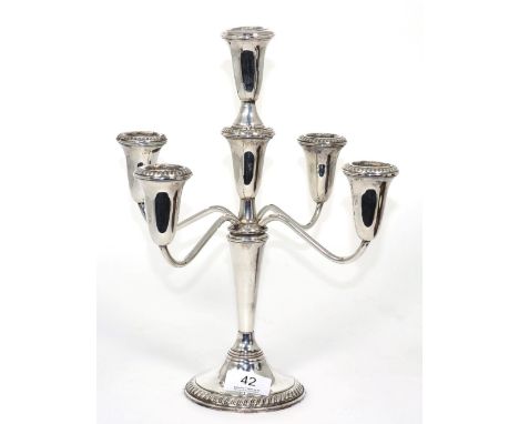 An American sterling five-light candelabra, stamped Empire Sterling, bearing Gump's label to base, 31cm in height