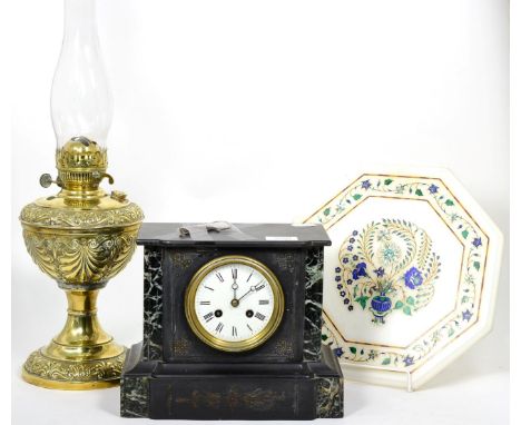 A Victorian black slate mantel clock; a brass oil lamp with anthemion decoration; and an Indian hardstone inlaid octagonal ma