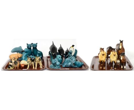 Poole pottery animals including a set of three graduated dolphins, together with a Beswick pigeon and five Beswick horses (a.