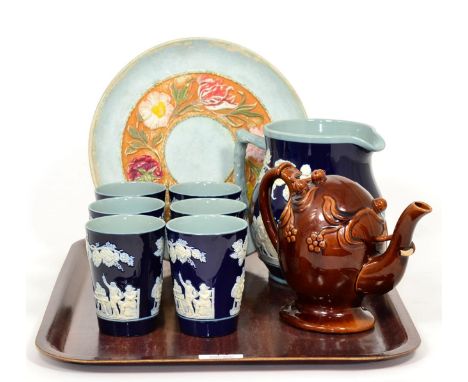 A treacle glazed Cadogan teapot; a Copeland Spode jug and six beakers and a Linthorpe pottery, Henry Tooth, later decorated 