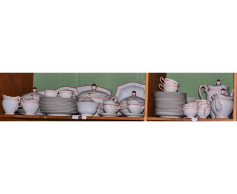 A comprehensive Hutschenreuther Selb Bavaria gilt and red bordered dinner and tea service (two shelves)