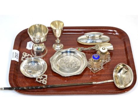 A tray of assorted small silver items including a tea strainer, a double measure, a Kiddush cup, a toddy ladle etc