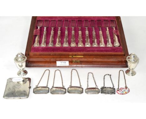 A cased set of eighteen pairs of silver handled dessert knives and forks; a pair of silver pepperettes; a silver cigarette ca