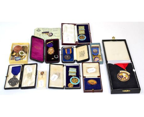 An 18 carat gold and enamel Independent Order of Oddfellows medal, dated 1893, cased; with a large collection of various lodg