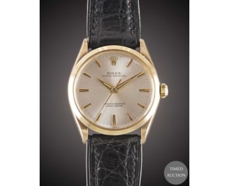 A GENTLEMAN'S 9CT SOLID GOLD ROLEX OYSTER PERPETUAL WRIST WATCH
CIRCA 1964, REF. 1002 WITH DAUPHINE HANDS
Movement:&nbsp;26J,
