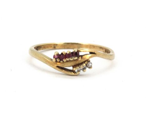 A 9ct yellow gold ruby and diamond set ring, (S).