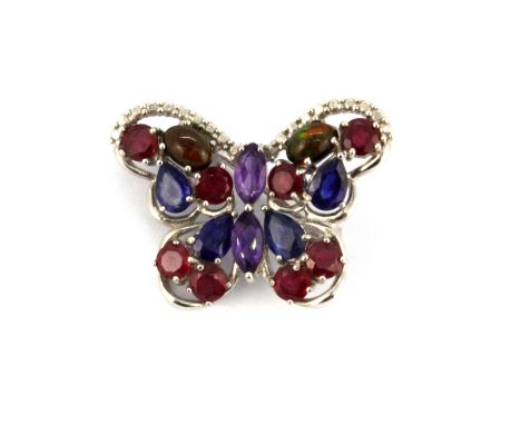 A 925 silver butterfly shaped brooch set with sapphires, rubies, amethyst and fire opals, L. 3cm.