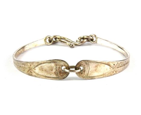 A silver bangle made with two 1799 Anne and Willian Bateman tea spoons.